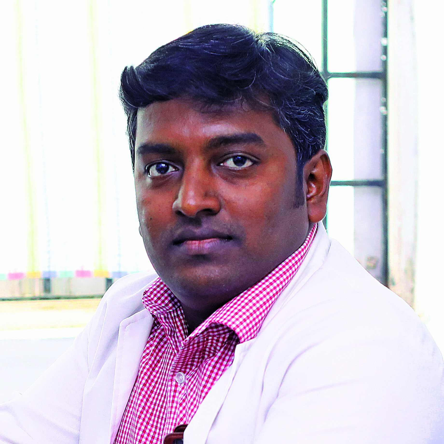 Dr. PRASAD T 